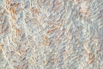 Texture of lime deposits on limestone hills of Pamukkale thermal springs in Turkey
