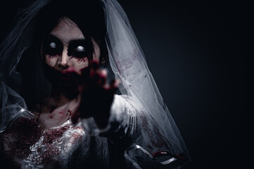 Halloween festival concept,Asian woman makeup ghost face,Bride zombie charactor,Horror movie...