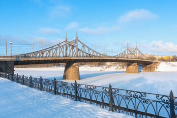 View of the Starovolzhsky bridge in the city of Tver on a clear winter day. Old metal bridge across the Volga.