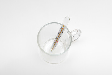 Medical thermometer. Glass thermometer for measuring human body temperature. pills for treatment. Measurement and treatment .