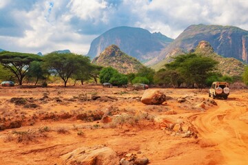 A safari vehicle against the background of Ndoto Mountains in Kenya