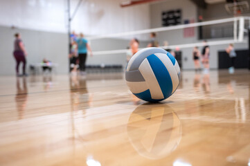 volleyball on the floor with people in the background