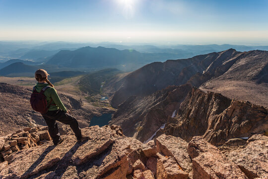 Hiker Looking Down From The Top Of Longs Peak In Colorado