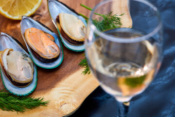 mussels open on a wooden platter