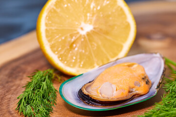 mussels open on a wooden platter