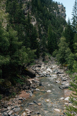 Fototapeta na wymiar Picturesque rocky river is flowing through gorge Zügenschlucht