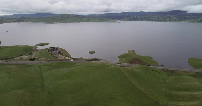 Highway and Lake. Upper Cottonwood Creek Wildlife Area with San Luis Reservoir in Background near Los Banos. California