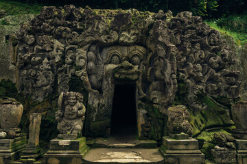 Demon carvings on entrance of cave temple