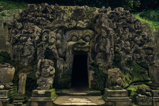 Demon carvings on entrance of cave temple