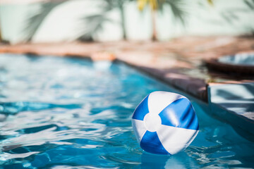 Inflatable ball drifting in swimming pool