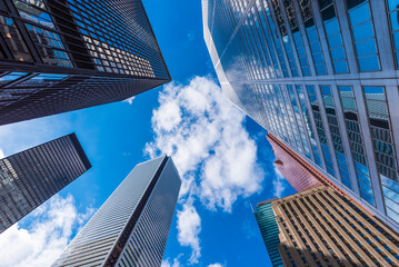 Skyscrapers reach for the blue sky in downtown Toronto Canada.
