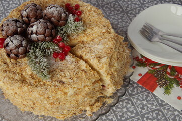Napoleon cake is decorated with New Year's composition.