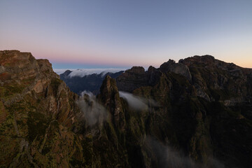 Great sunrise on the Pico do Arieiro in Madeira with epic fog wrapping around the Ninho da Manta.
