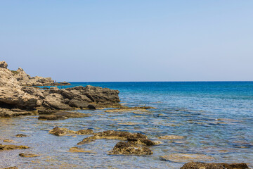 Fototapeta na wymiar Beautiful view of rocks on coastline Mediterranean sea. Greece.