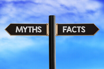 Fototapeta premium Myths and facts concept. Road sign with words myths and facts on sky background.