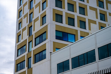 Office high rise with white and green exterior.