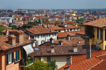 Fototapeta na wymiar View of the redroof historical buildings in the Bergamo in northern Italy. Bergamo is a city in the Lombardy region.