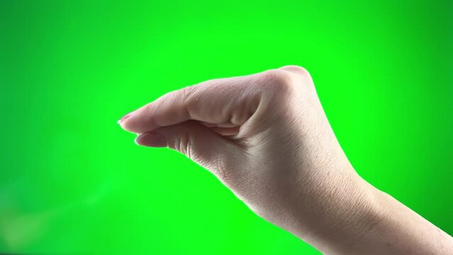 two hands play on green background chromakey Man and woman they seem to be birds fit each other collarbone and kiss funny video Love tenderness closeness man's hand absorbs