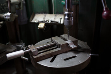 Part machining with drilling machine