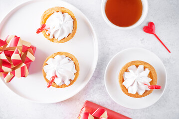 Sweet tartlets with cream in a plate