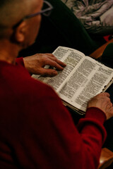 Naklejka premium person reading a bible