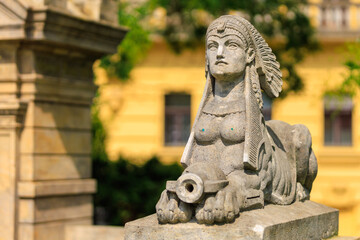 Fototapeta premium Ancient sculptures in the architecture of the city. Historical and cultural heritage. Background.