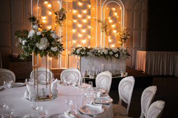 Luxury wedding table setting with flower centerpieces and candles