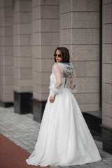 Fototapeta premium stylish caucasian bride in white wedding dress 