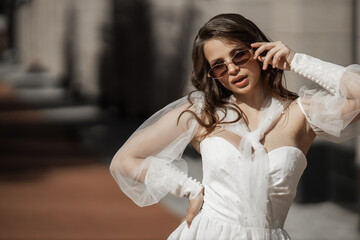 face of a beautiful bride in sunglasses