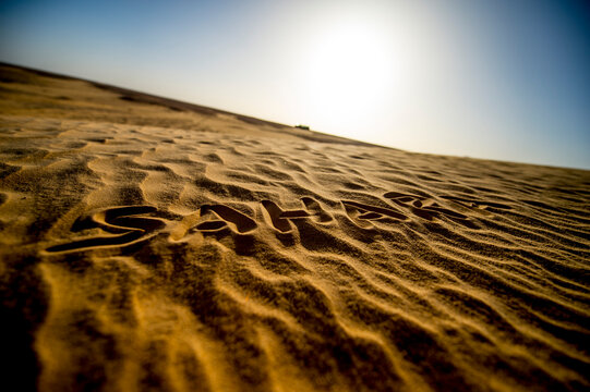 Sahara written in the desert sand