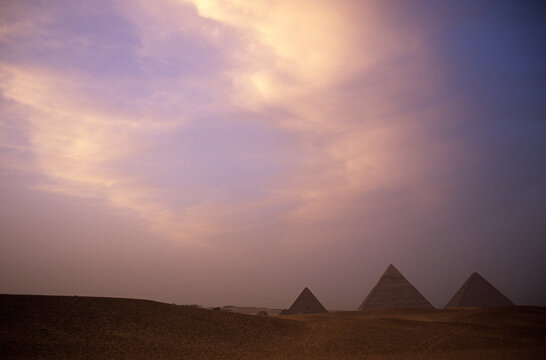 The Pyramids of Giza at sunset, outside of Cairo, Egypt.