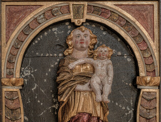 medieval wood carving depicting the madonna and the child