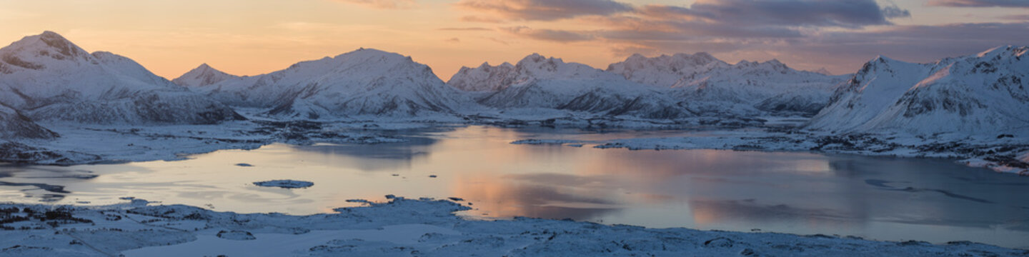 Winter view over coast and mountains from summit of Hoven, GimsÃ¸y, Lofoten Islands, Norway