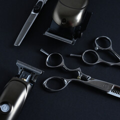 Barber's tools: professional scissors and hair trimmer. Salon tools in jobs and career concept