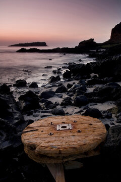 A large cable spool lies on a beach closed to tourists on Santa Cruz Island in the Galapagos.
