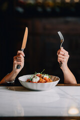 person eating a salad