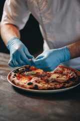 restaurant chef preparing pizza