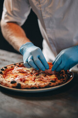 restaurant chef preparing pizza
