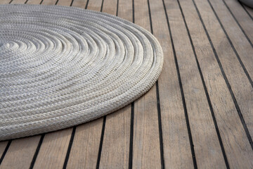 Teak and line on deck of a sailing yacht.