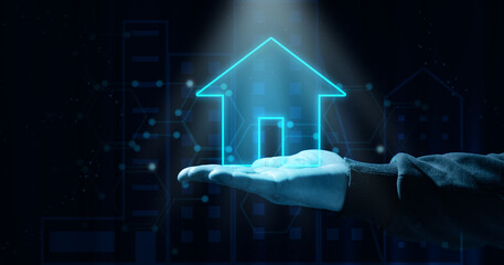 Man's hand holding virtual house neon icon isolated on blue background. Real estate insurance...