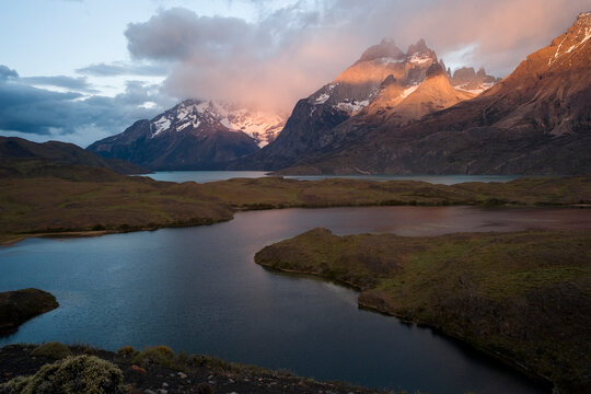 The Cuernos del Paine, or Paine Horns, peak from the mist over Lago Nordenskjold.