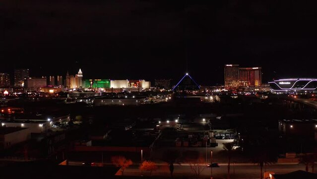 Aerial close-up panning shot of the south Las Vegas Strip at night. 4K
