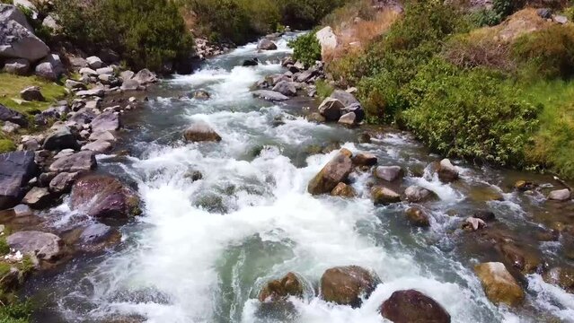 Overtake Shot Of Flowing River Through Green Wild Nature, Obrajillo, Peru