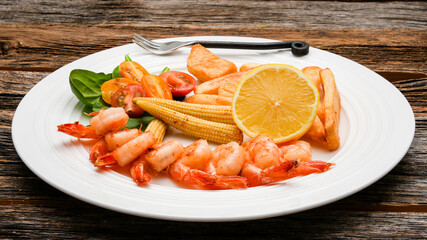Close up from seafood on plate with lemmon on rustic table
