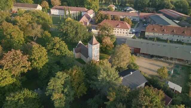 evangelic rural church. Majestic aerial view flight panorama orbit drone
Village church Paretz Brandenburg Havelland Germany summer evening 2022. High Quality 4k Cinematic footage