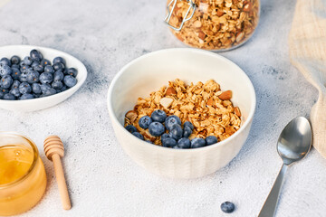 Fresh fragrant homemade granola made from oatmeal, honey and nuts. Balanced breakfast or snack