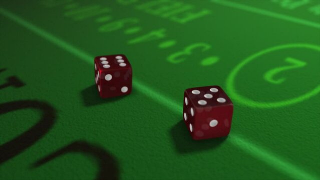 Pair of dice thrown onto a craps or crapaud table with glittering poker machines in a casino background - craps throws - translucent red dice throw of five and six - eleven