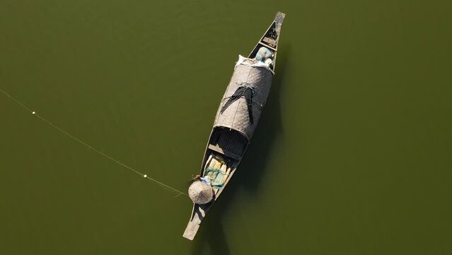 fisher man Net fishing in river of Surma, Bangladesh, aerial top down view