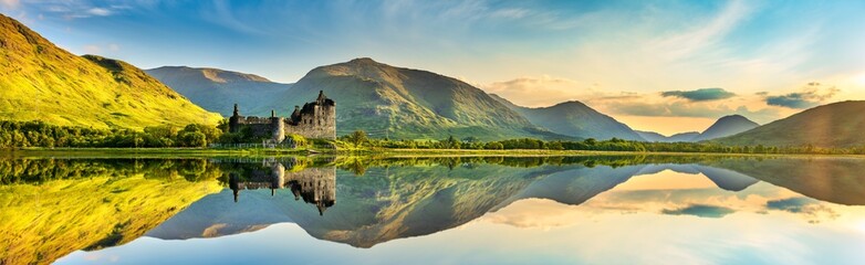 The ruins of Kilchurn castle on Loch Awe at sunset in Scotland