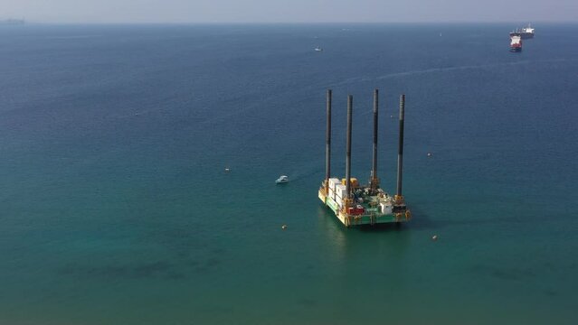 Offshore Area Jackup rig or Self-elevating Platform SEP For Marine Oil Exploration in Eilat city, Israel - Aerial Orbiting Around